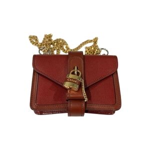 Chloe Gold and Brown Crossbody Bag with Elegant Hardware and Structured Shape